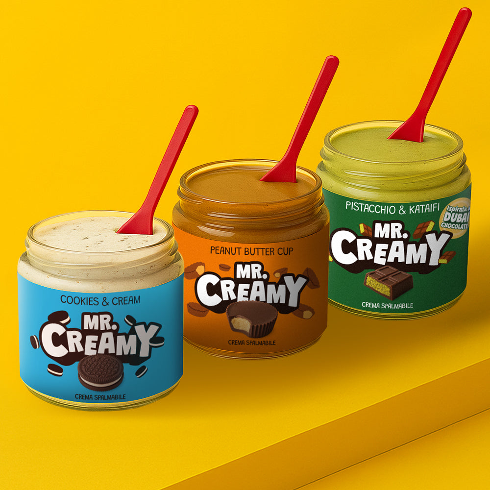 3 confezioni, le più vendute, di creme spalmabili da 200g Mr Creamy: vasetti aperti con cucchiaio dentro al gusto di pistacchio e kataifi, cookies and cream e peanut butter cup